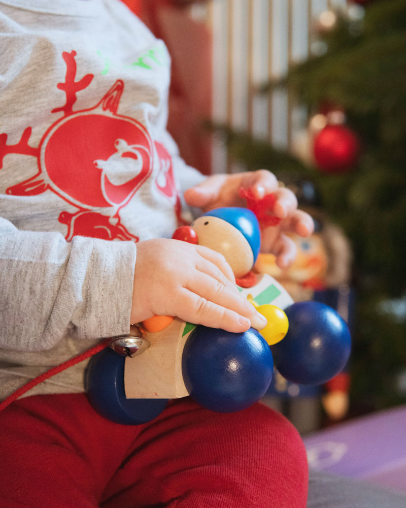 Baby with autolino wooden toy by Selecta