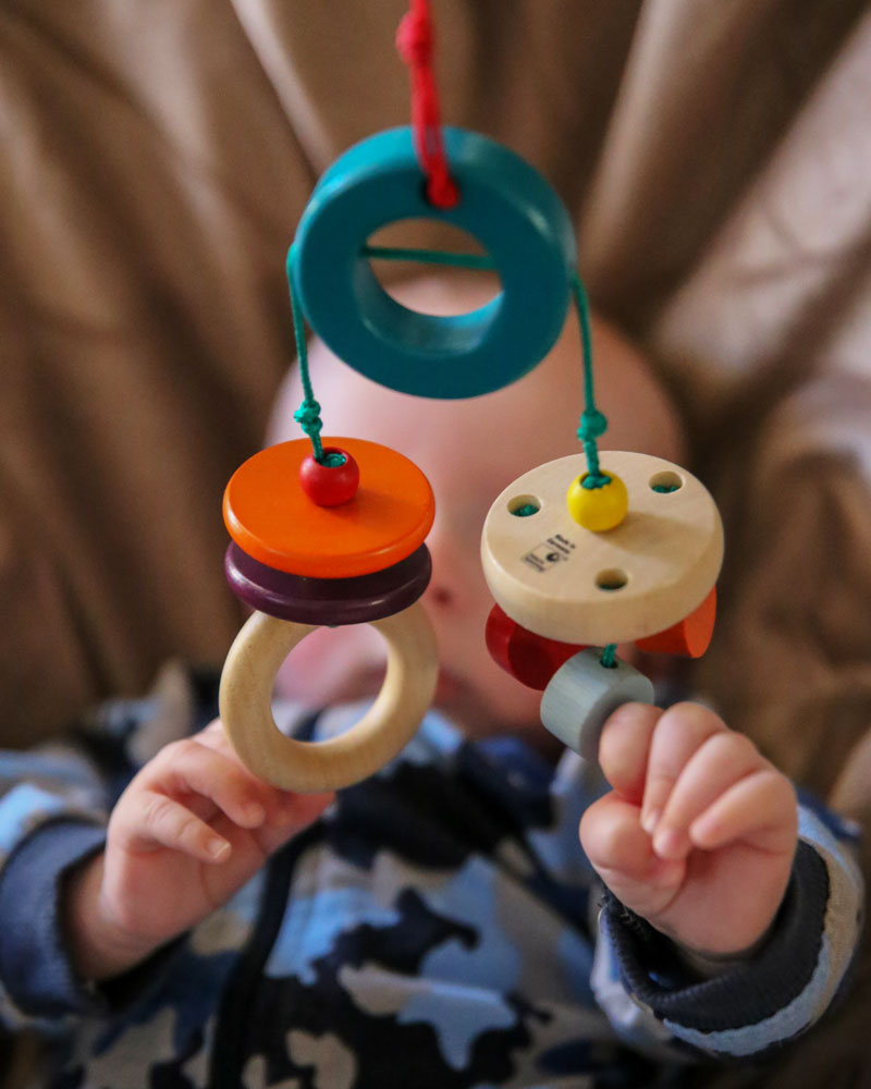 Baby with klappadu wooden toy by Selecta